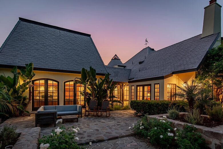 Outdoor sitting area and property at night